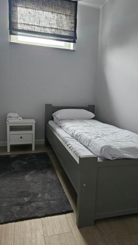 Postel nebo postele na pokoji v ubytování Apartamenty Szkolna JFTC
