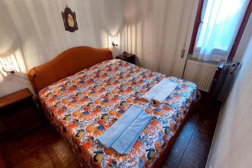 Krevet ili kreveti u jedinici u okviru objekta Il Quadrifoglio Bilocale tra Lavagna e Chiavari