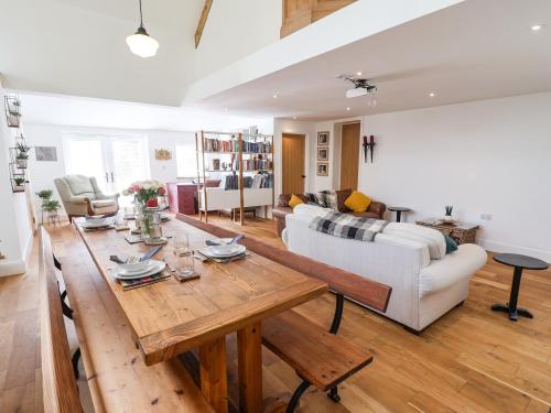 a living room with a table and a couch at The Chapel in Alfreton