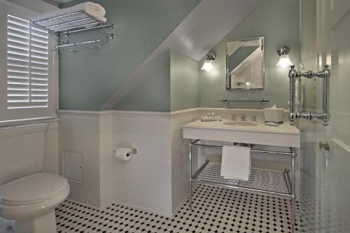 a bathroom with a sink and a toilet at Inn on Boltwood in Amherst