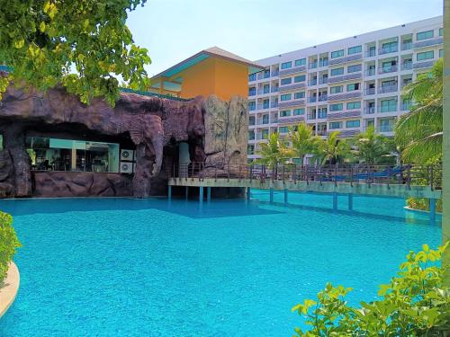 a swimming pool in front of a resort at Laguna Beach Resort 3 Maldives in Jomtien Beach
