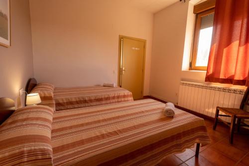 Postel nebo postele na pokoji v ubytování El Miracle