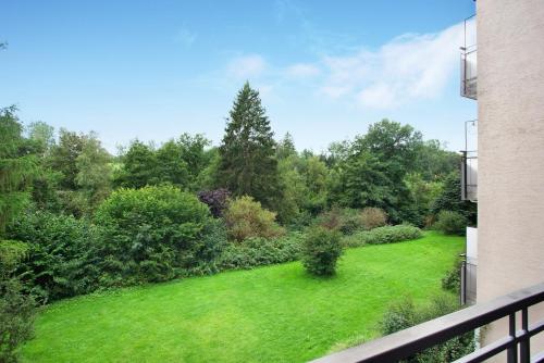 a view of a yard from a balcony at Kleine Auszeit in Brilon