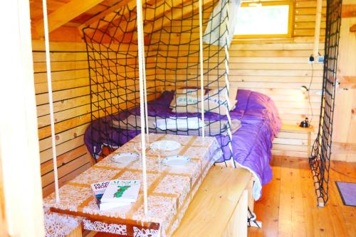 Ένα ή περισσότερα κρεβάτια σε δωμάτιο στο Camping Alsace Les Castors