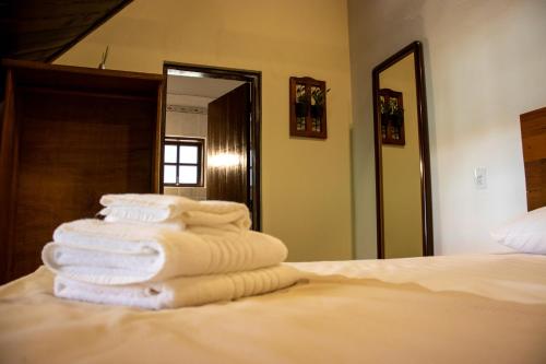 Katil atau katil-katil dalam bilik di Hotel Dona Paschoalina