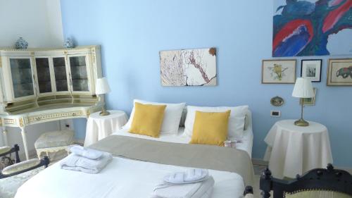 Ένα ή περισσότερα κρεβάτια σε δωμάτιο στο Casa dell'Inno di Mameli