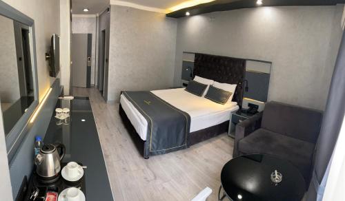 Letto o letti in una camera di alfin otel