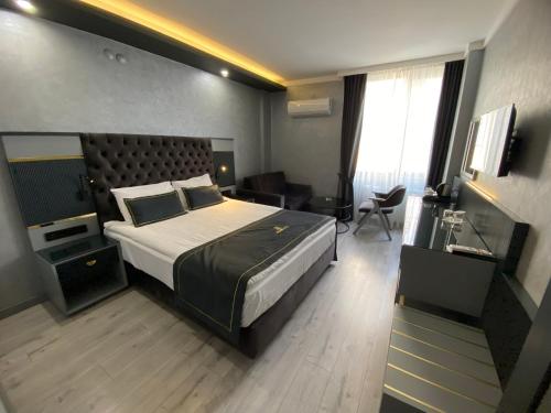 Letto o letti in una camera di alfin otel