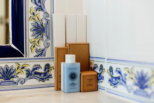 a room with blue and white tiles and a camera at Hotel Los Ángeles Denia in Denia