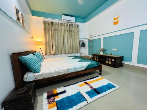 a bedroom with a bed and a rug at *URBAN HOME*-A Luxe Contemporary 1BHK Apartment in Guwahati