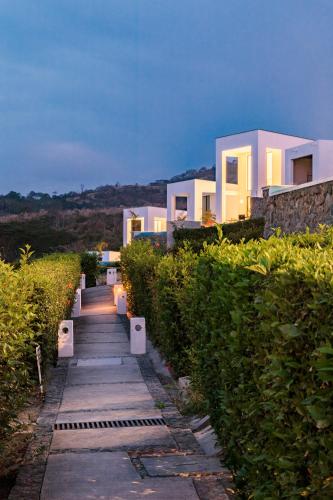 a set of stairs leading up to a house at Jama Campay - Homes Resort & Spa in Jama