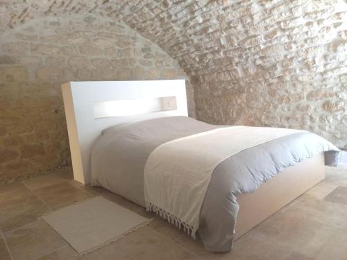 Ένα ή περισσότερα κρεβάτια σε δωμάτιο στο Le Clos du rempart - 2 à 4 pers.