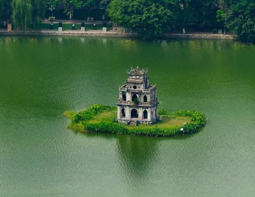 a small island in the middle of a body of water at Old Quarter Autumn Hanoi in Hanoi