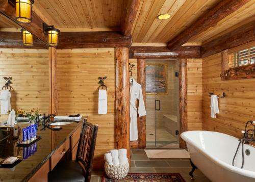 a bathroom with wooden walls and a tub and a sink at The Chatwal Lodge (All-Inclusive) - in The Unbound Collection by Hyatt in White Lake