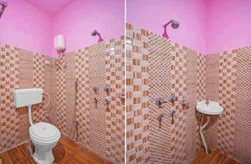 a pink bathroom with a toilet and two sinks at Hotel Salt Lake Palace Kolkata Sector II Near Dum Dum Park - Fully Air Conditioned and Spacious Room - Couple Friendly in Kolkata