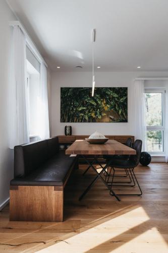 a living room with a couch and a table at Das Dietrich - Landhaus 64 in Leibnitz