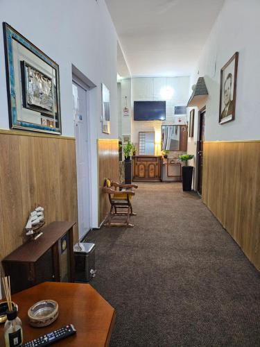 an office with a hallway with a desk and a chair at Prenociste Nikolas Grand in Smederevo
