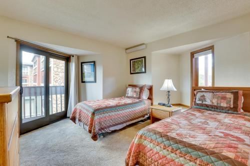 a hotel room with two beds and a window at Mtn Condo with Ski Locker and Pools - 3 Mi to Resort! in Winter Park