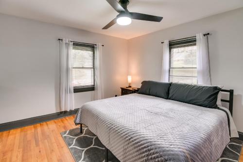 a bedroom with a bed and a ceiling fan at Mullens Home - Close to Hatfield-McCoy Trailhead! in Mullens