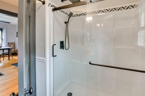 a shower in a bathroom with a glass door at Mullens Home - Close to Hatfield-McCoy Trailhead! in Mullens