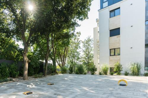 a courtyard in front of a building at Club Panorama Lake View Apartment in Alsóörs