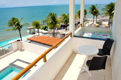a balcony with a view of the ocean at La Suite Praia Hotel in Caucaia
