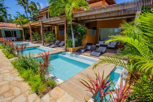 an image of a house with a swimming pool at Pousada Mi Secreto in São Miguel do Gostoso