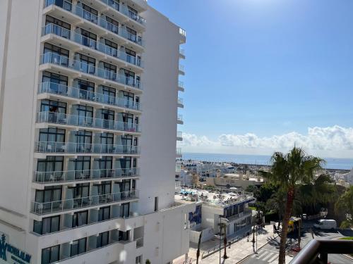 a view of the ocean from the balcony of a building at Beach Apartment - Benalmadena Costa in Benalmádena