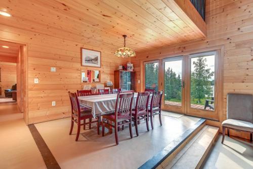 a dining room with a table and chairs at Spacious Soldotna Home with Mackey Lake Views! in Soldotna
