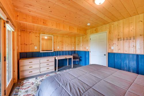 a bedroom with a bed and a desk at Spacious Soldotna Home with Mackey Lake Views! in Soldotna