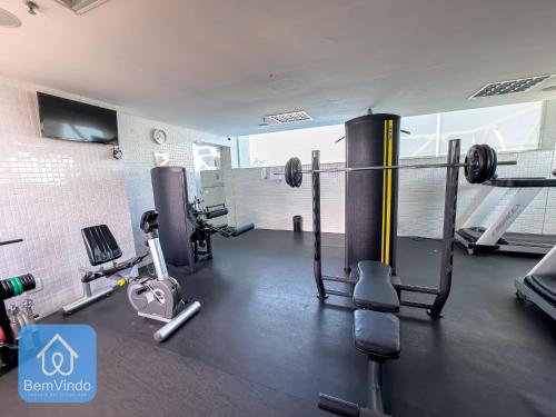 a fitness room with a gym with weights at Apartamento em frente ao Salvador Shopping in Salvador