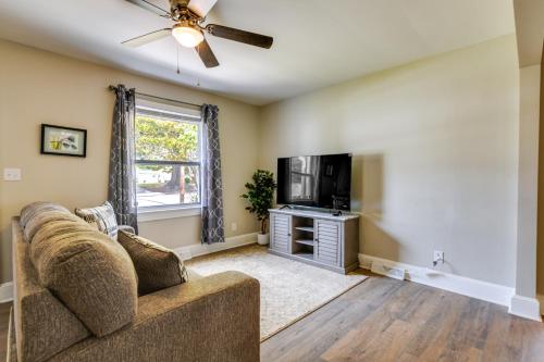 a living room with a couch and a tv at Hopewell Vacation Rental about 3 Mi to James River in Hopewell