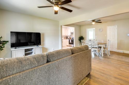 a living room with a couch and a flat screen tv at Hopewell Vacation Rental about 3 Mi to James River in Hopewell