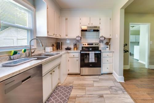 a kitchen with white cabinets and a sink at Hopewell Vacation Rental about 3 Mi to James River in Hopewell