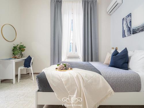 Letto o letti in una camera di Casa MaNa - L'Opera Group