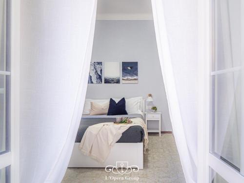 Letto o letti in una camera di Casa MaNa - L'Opera Group