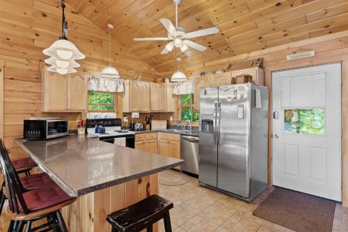 a kitchen with a refrigerator and a ceiling fan at Moonbeams & Fireflies in Chestertown