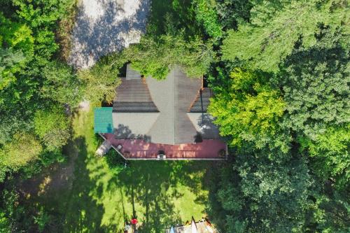 an overhead view of a house in the middle of a forest at Moonbeams & Fireflies in Chestertown