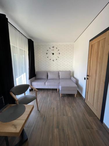 a living room with a couch and a table at Шишка in Bukovel