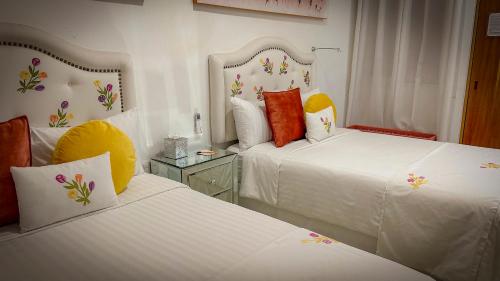 Ein Bett oder Betten in einem Zimmer der Unterkunft ArcoSodi Hotel Boutique