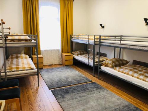 a room with four bunk beds in a room at My easy home in Hamburg