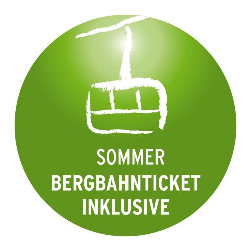 a green button with a sign for a summer bender bartender inclusive at Familien- und Wellnesshotel "Landhaus Viktoria" in Oberstdorf