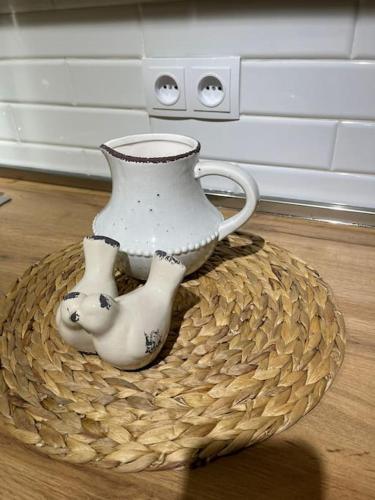 a vase sitting on top of a basket at Sofia's Garage in Tbilisi City