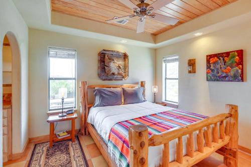 a bedroom with a bed and a ceiling fan at Vibrant Terlingua Vacation Rental Near Big Bend! in Terlingua
