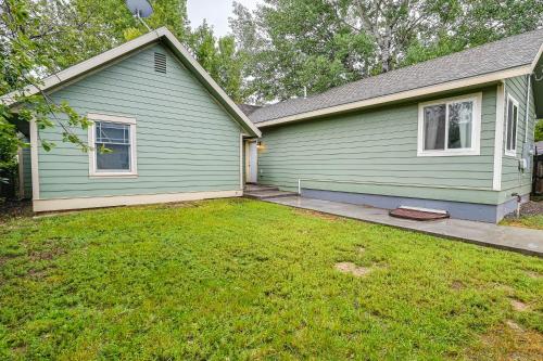 a green house with a lawn in front of it at Laramie Gem Less Than half Mi to University of Wyoming! in Laramie