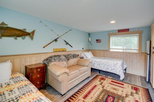 a living room with a couch and a bed at Pet-Friendly Westport Vacation Rental with Hot Tub! in Westport