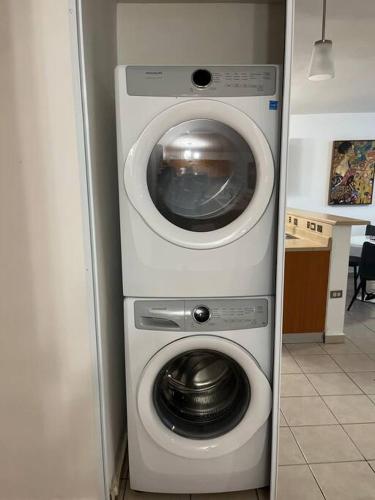 a washing machine and a washer in a kitchen at Lovely 2 bedroom condo with pool and beach access in Rincon