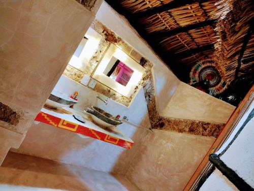 a view of a bathroom with a shower in a building at Casa Maya - Alberca - Wifi Starlink - Tour Sostenibilidad in Izamal