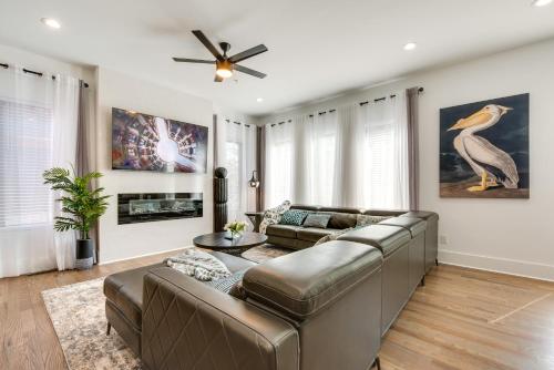 a living room with a couch and a ceiling fan at Modern Atlanta Vacation Rental 2 Mi to Downtown! in Atlanta