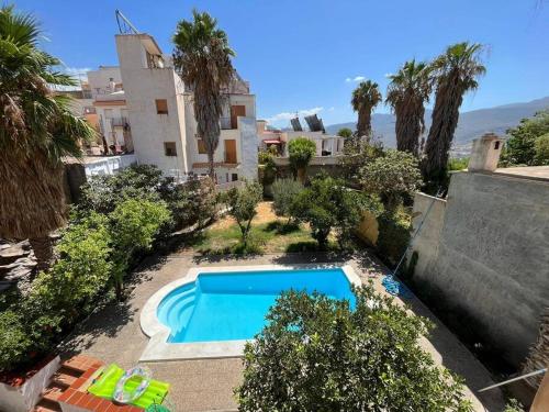 an aerial view of a house with a swimming pool at Casa De Noor in Órgiva